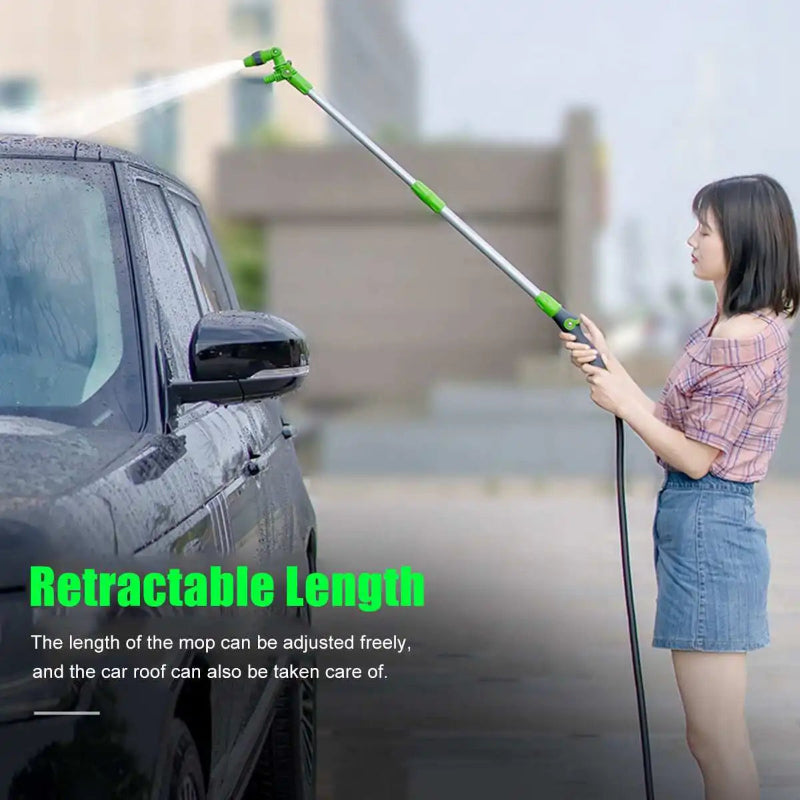 Person using a retractable car washing mop on a car