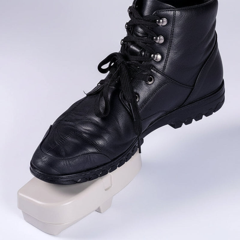 Black leather shoe on a white platform with 'Durable Material ABS' text.