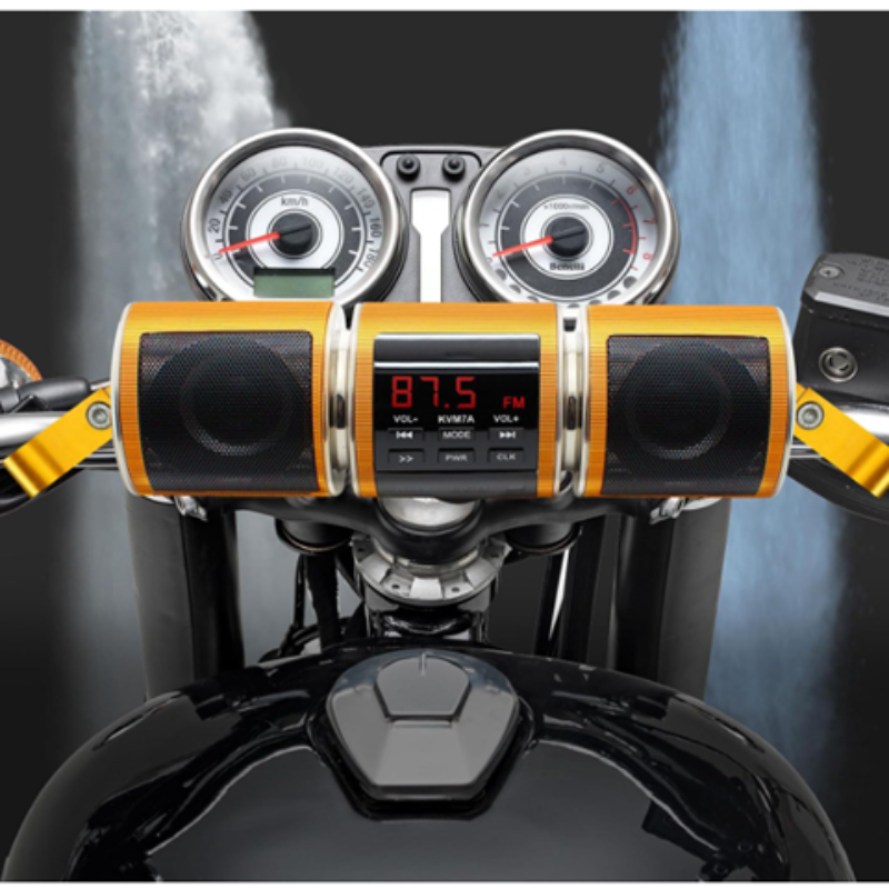 Motorcycle handlebar with audio system and digital display against a blurred background