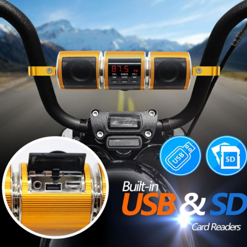 Motorcycle handlebar with built-in USB and SD card reader against a mountain road background