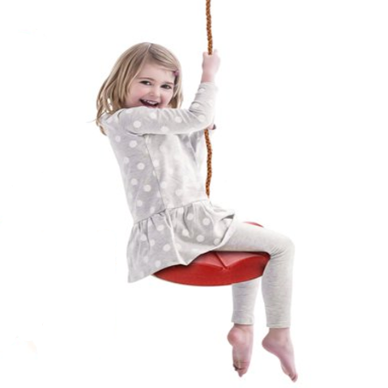 Child on a red swing set with a white background