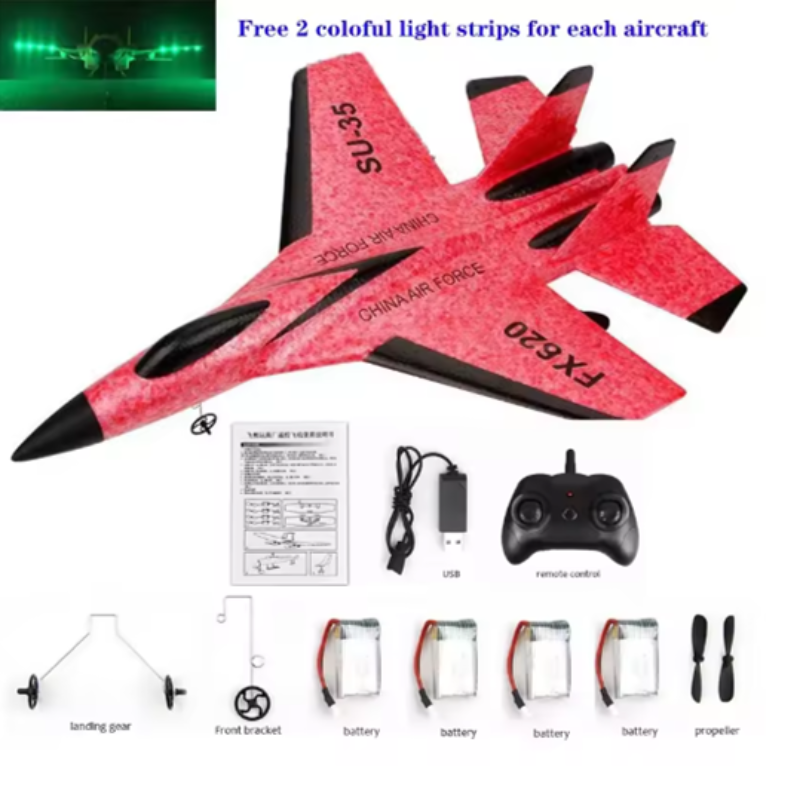 Red toy airplane with black accents, remote control, and accessories on a white background.