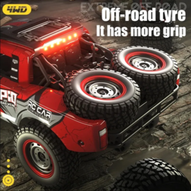 Red off-road RC car with large tires on a rocky surface, featuring 4WD branding.