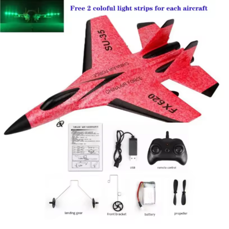 Red toy airplane with black accents, remote control, and accessories on a white background.