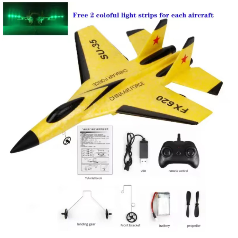 Yellow model airplane with remote control and accessories on a white background