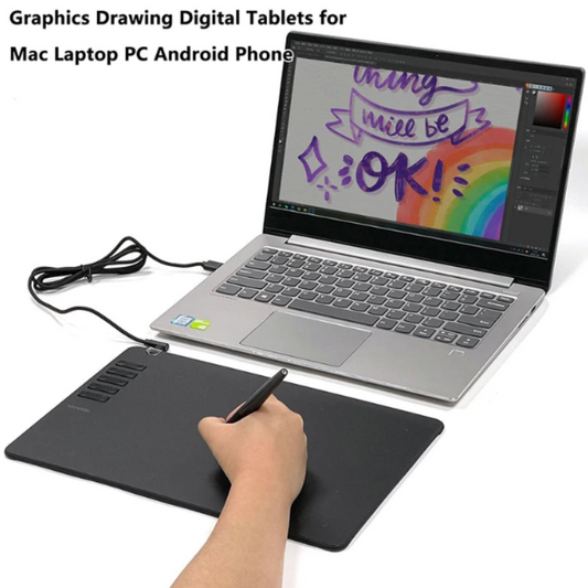 Person using a graphics drawing digital tablet with a laptop displaying a colorful message.