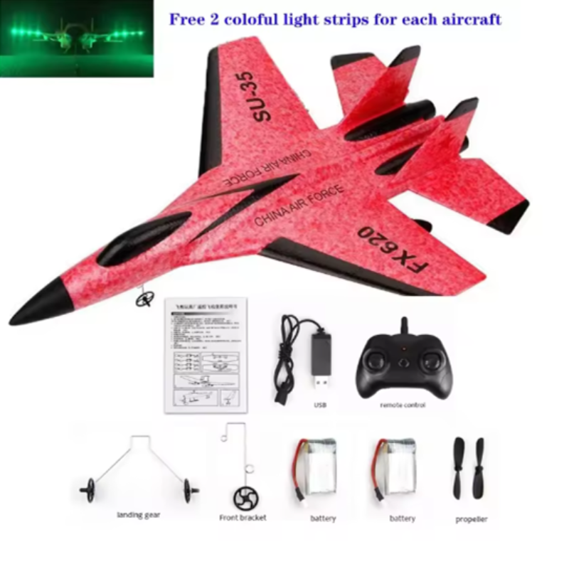 Red toy airplane with remote control, battery, and propeller on a white background