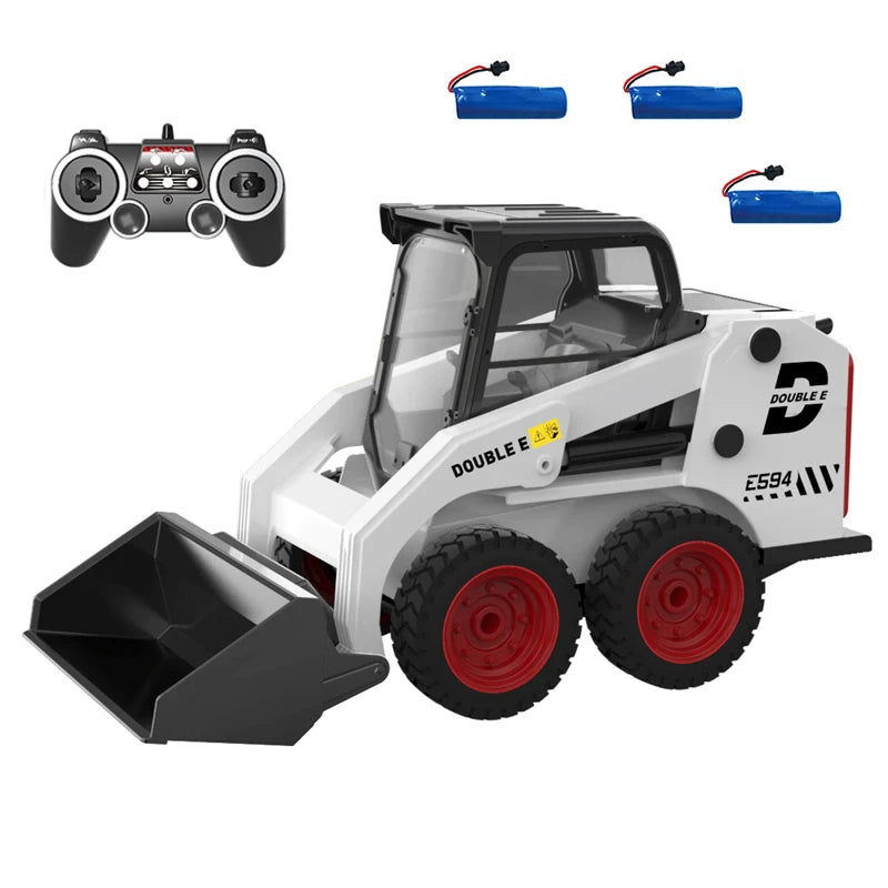 White and black remote control toy skid steer loader with red wheels, shown with a black remote controller, two blue batteries, and a small black storage box on a white background.