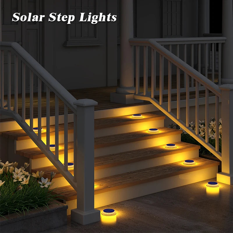 Solar step lights illuminating a set of outdoor stairs.