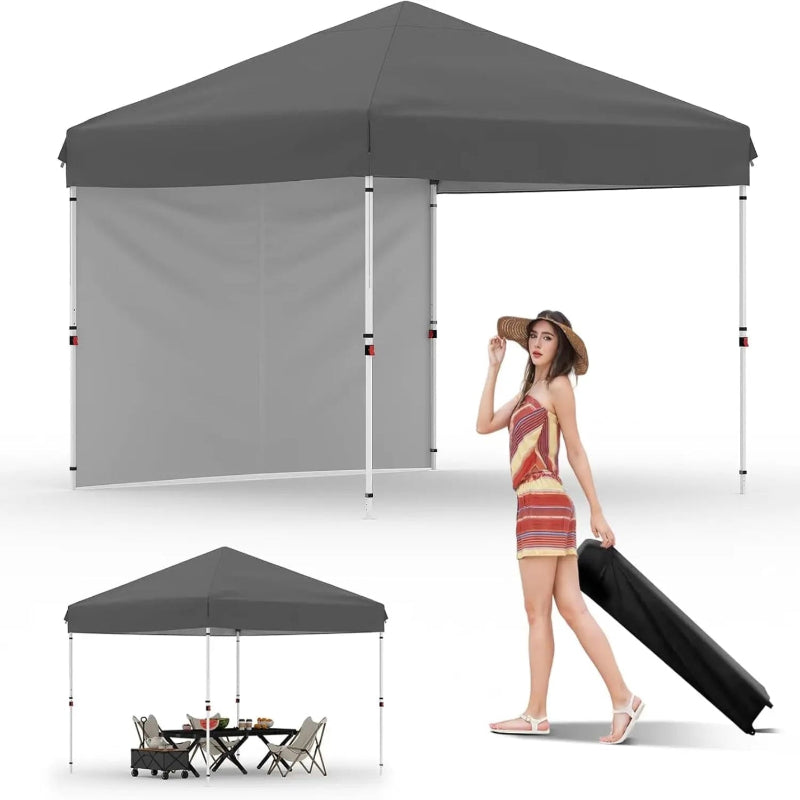 Gray pop-up canopy tent with side panel, woman with suitcase, and outdoor furniture set.
