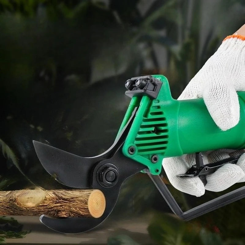 Gardening shears with green handle held by a gloved hand against a blurred natural background