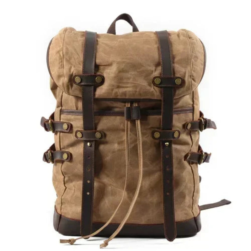 Brown backpack with leather straps on a white background