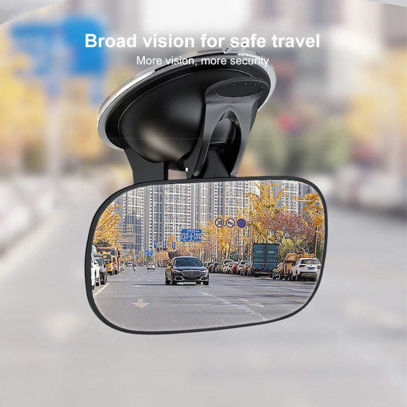 Car rearview mirror with a blurred city street background