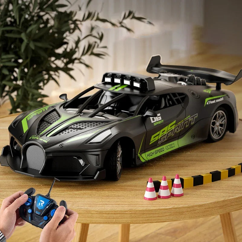 Toy car with remote control on a table with traffic cones