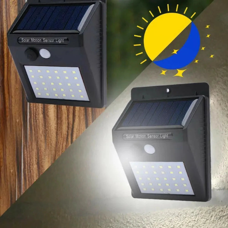 Two solar motion sensor lights on a wooden and concrete wall with a sun and moon icon.