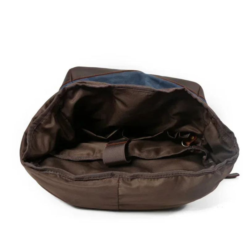 Brown backpack with blue interior on a white background