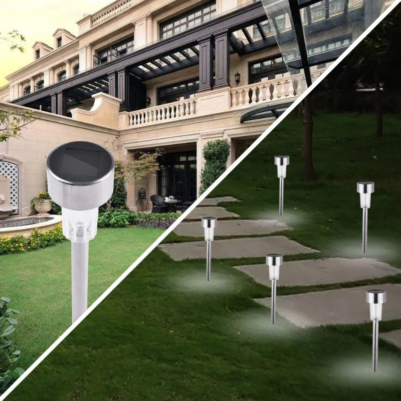Solar garden lights illuminating a pathway in a garden