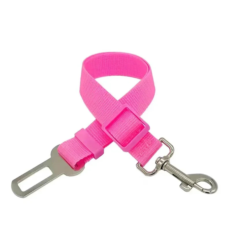 Pink dog car seat belt with metal clip on a white background