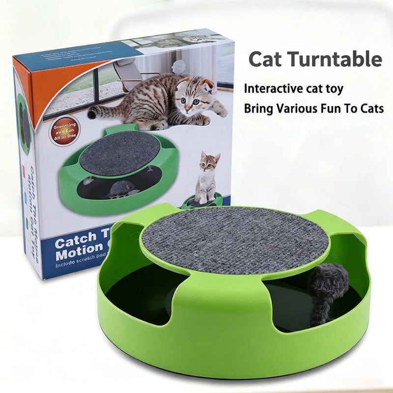 Green circular cat toy with a gray scratching platform and a dark plush toy inside, shown in front of its retail box. Text on the image reads 'Cat Turntable' and 'Interactive cat toy Bring Various Fun To Cats'.
