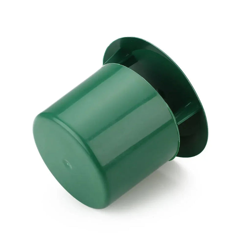 Green plastic cap on a white background