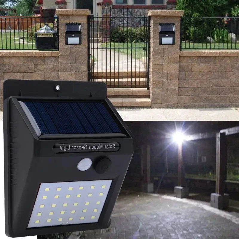 Solar motion sensor light attached to a wall with outdoor setting