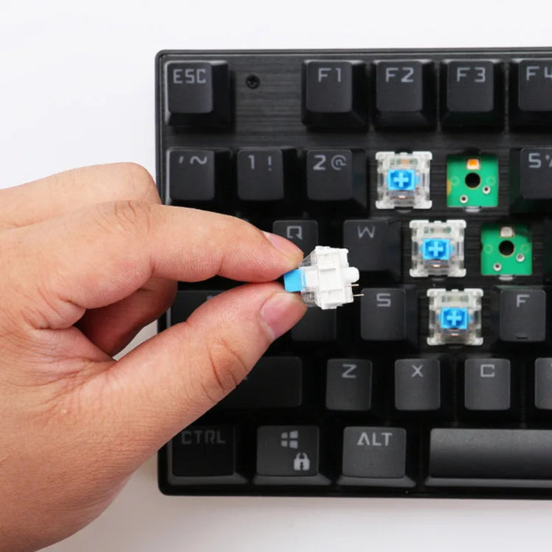 Hand replacing a key on a mechanical keyboard with visible switches.