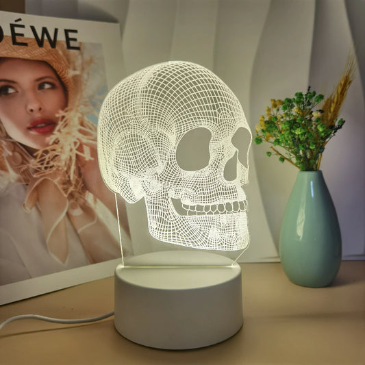 Skull-shaped lamp on a table with a vase and photo frame in the background