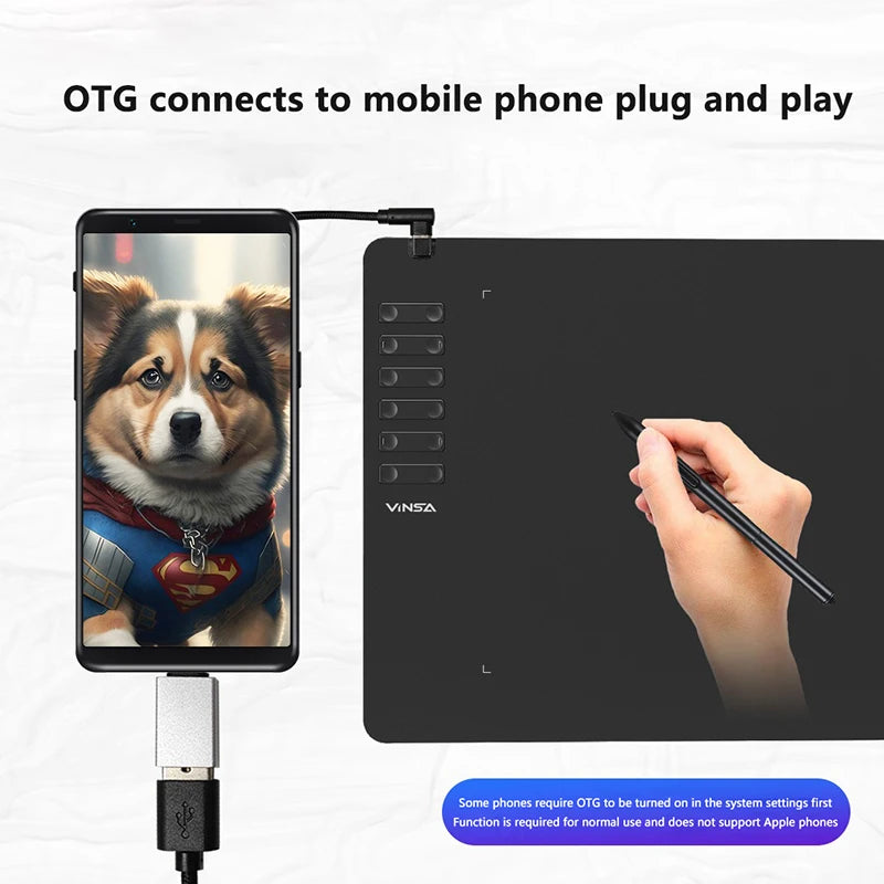 Graphite digital drawing pad with smartphone displaying a dog photo and hand holding a pen.