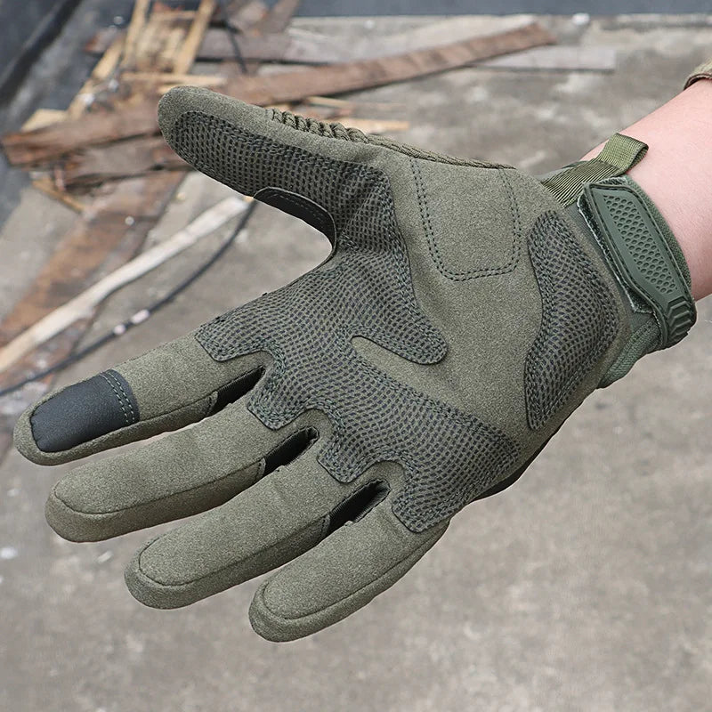 Green tactical glove on a blurred background
