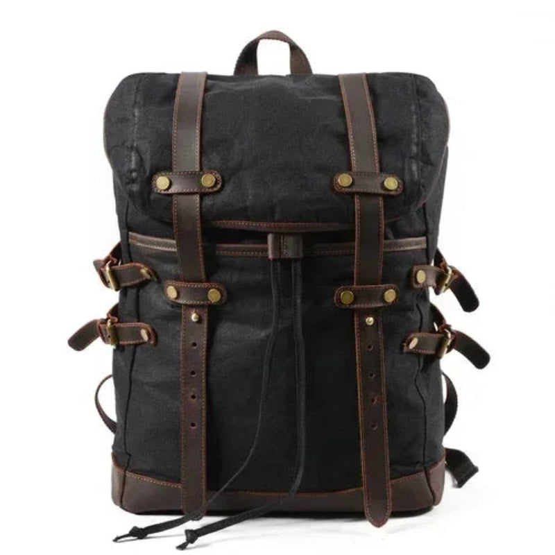 Black backpack with brown straps on a white background