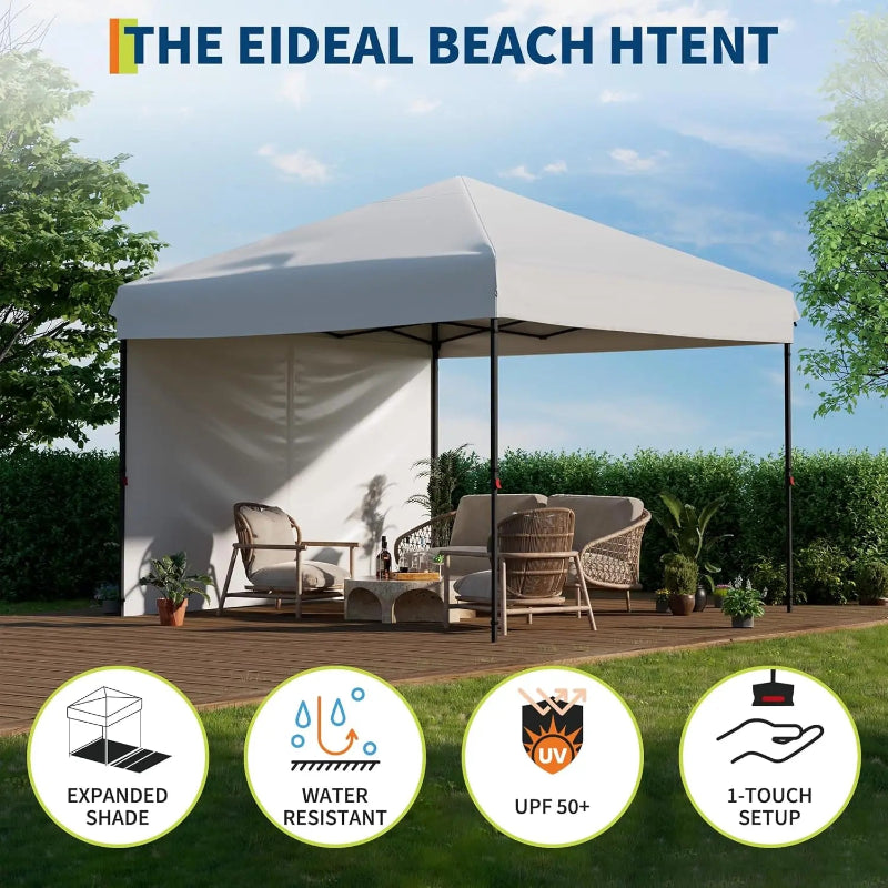 Beach tent with furniture and features highlighted on a grassy area