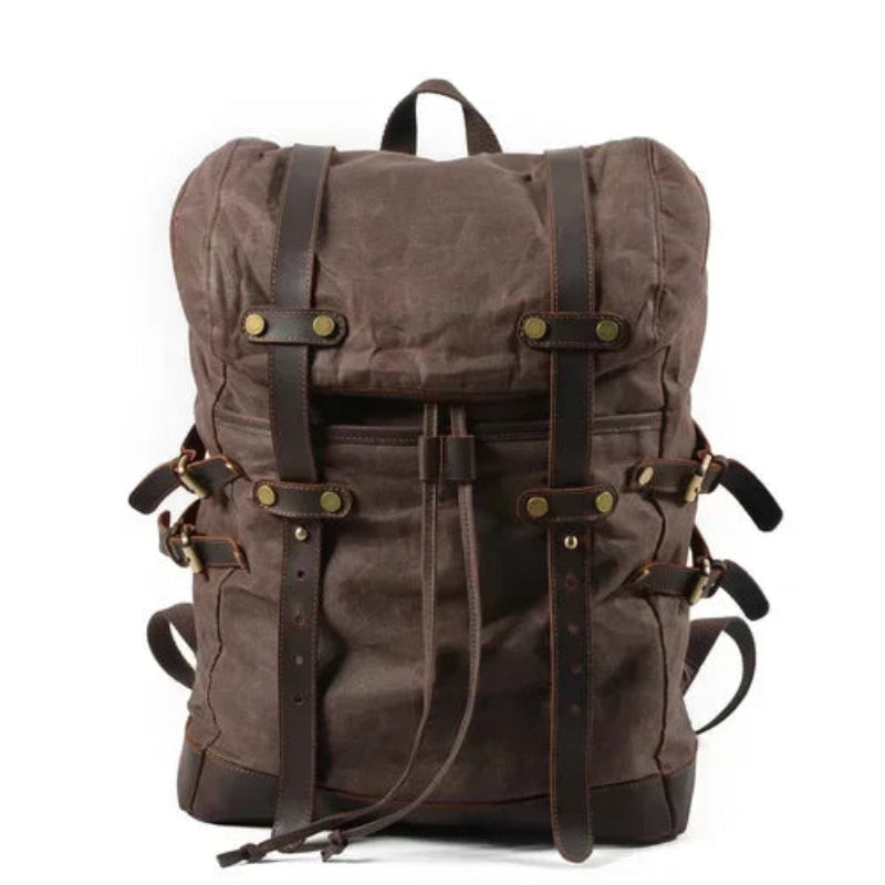 Brown backpack with leather straps on a white background