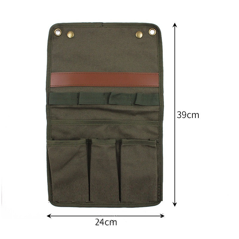 Green fabric roll-up tool pouch with brown strap and measurements on a white background