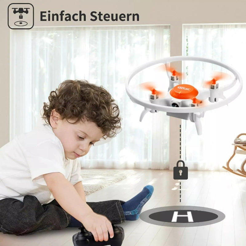 Child playing with a small drone indoors
