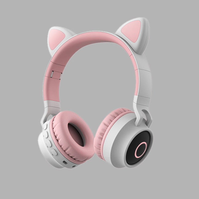 Pink and white headphones with cat ear design on a gray background #ledlight #catearheadphones #wireless #bluetooth5.0 #headset #portable #foldable #kidsheadphone #withmicrophone #bestgift #with mic #micrphone #rechargeablebattery #sd card