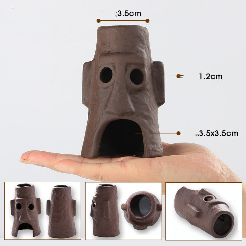 Small brown ceramic object with measurements on a white background
