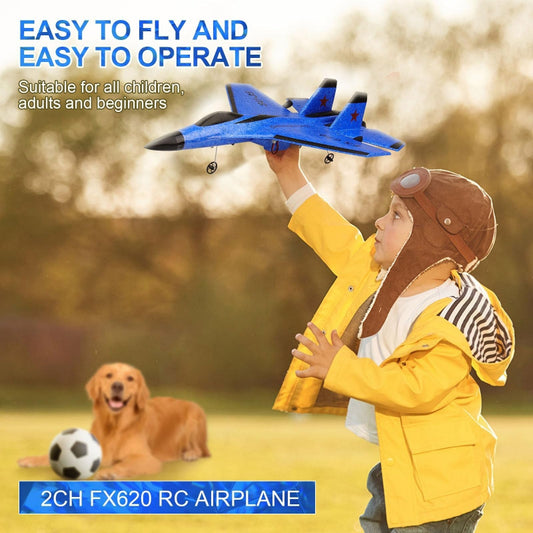 Child holding a blue RC airplane with text about its features, outdoors.